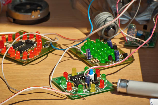 istock Electronics and robotics of handmade. Microcircuits, LEDs and colored wires close up. Electronic devices and mechanisms are presented at the scientific exhibition. 1153704490