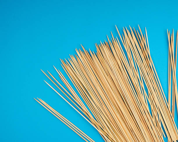 istock wooden bamboo sticks on a blue background 1153704827