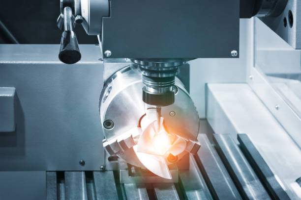 istock metalworking industry. drilling a hole on modern metal working machining center 1153705701