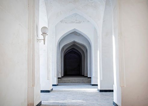 White Arabian arches in Kalyan Mosque that was built 16th-century. Bukhara, Uzbekistan. Central Asia.