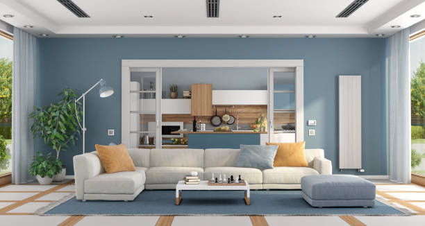 Living room with sofa and modern kitchen on background Large Living room with elegant sofa and modern kitchen on background - 3d rendering
the room does not exist in reality, Property model is not necessary blue house stock pictures, royalty-free photos & images