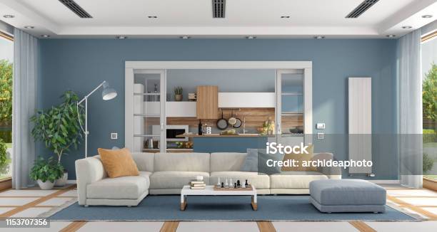 Living Room With Sofa And Modern Kitchen On Background Stock Photo - Download Image Now