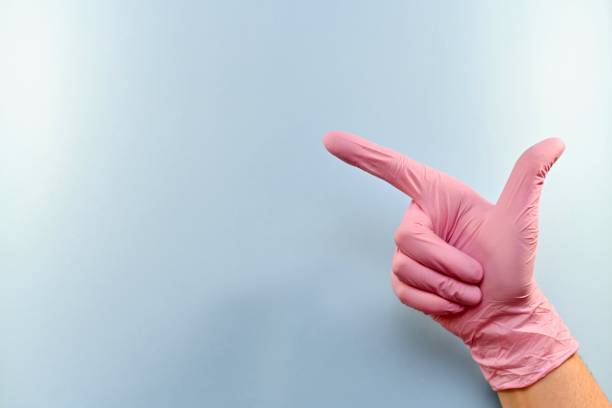 istock The right gloved hand is pointing. 1153707668