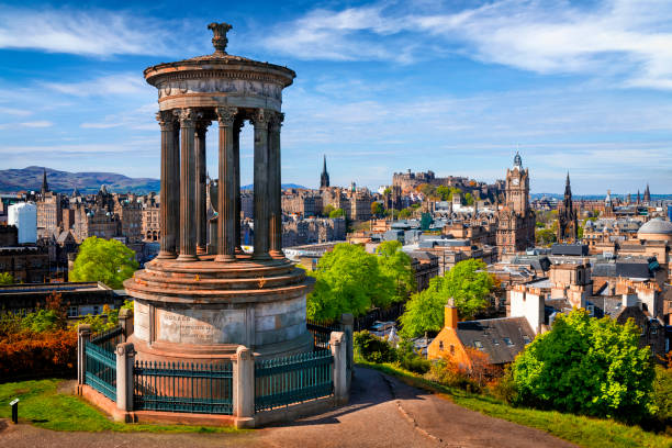 Dugald Stewart Monument and view over historic Edinburgh from Calton Hill, Scotland, UK Dugald Stewart Monument and view over historic Edinburgh from Calton Hill, Scotland, UK edinburgh scotland photos stock pictures, royalty-free photos & images