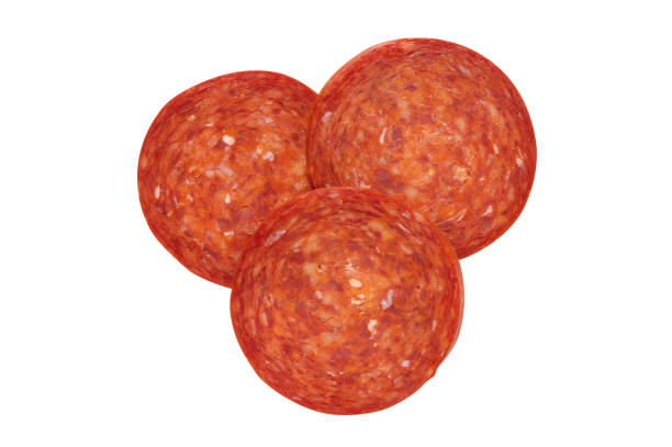 istock Pepperoni slices isolated on white with clipping path, shot from above. 1153708765