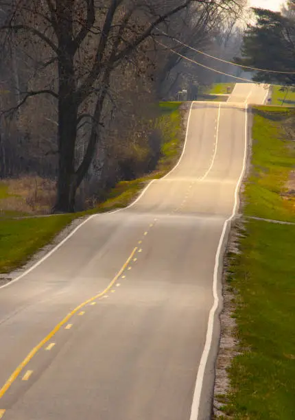 Photo of Hilly country road distorted, abstract telephoto image.