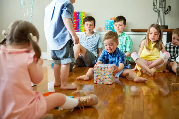 Photo of Birthday party of little boy with down syndrome