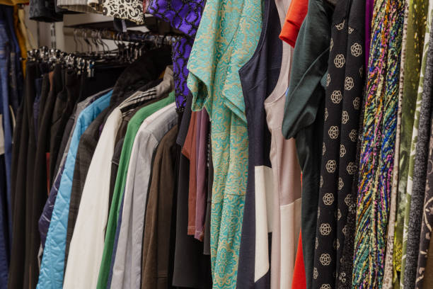istock Beautiful colorful clothes in a store on hangers 1153711183