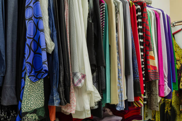 istock Beautiful colorful clothes in a store on hangers 1153711237