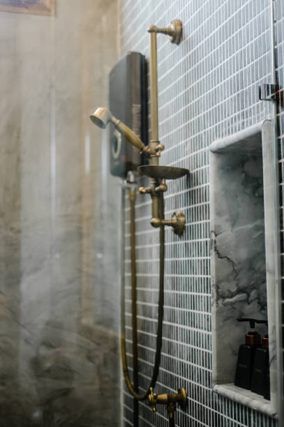 istock Unlacquered brass rail and showerhead, loft bathroom 1153713368