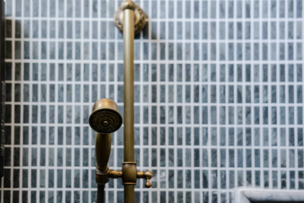 Unlacquered brass shower set, gray bathroom tile