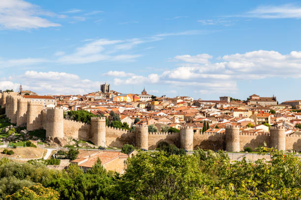 Panoramic view of the historic city of Avila from the Mirador of Cuatro Postes, Spain, with its famous medieval town walls. UNESCO World Heritage. Called the Town of Stones and Saints Panoramic view of the historic city of Avila from the Mirador of Cuatro Postes, Spain, with its famous medieval town walls. UNESCO World Heritage. Called the Town of Stones and Saints mirador stock pictures, royalty-free photos & images