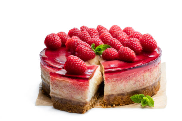 Homemade cheesecake with raspberry jelly isolated on white
