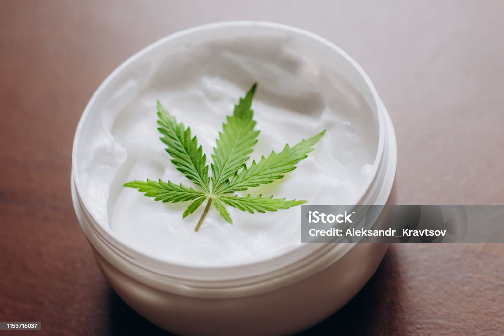 Cosmetic cream made of natural cannabis, hemp, moisturizing lotion with CBD content. Copy space for your design use,text Moisturizer Stock Photo