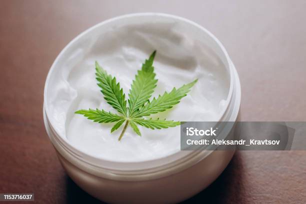 Cosmetic Cream Made Of Natural Cannabis Hemp Moisturizing Lotion With Cbd Content Copy Space For Your Design Usetext Stock Photo - Download Image Now