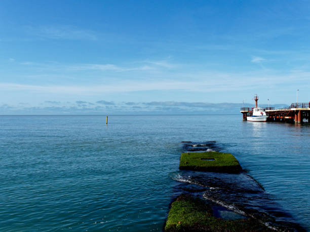 Sochi, Russia - May 15, 2019: sunny seascape with a moored motor boat