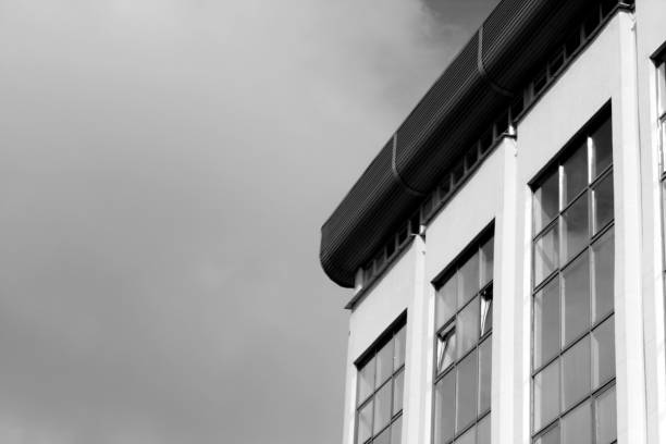 istock Part of modern building against sky in black and white. 1153717817