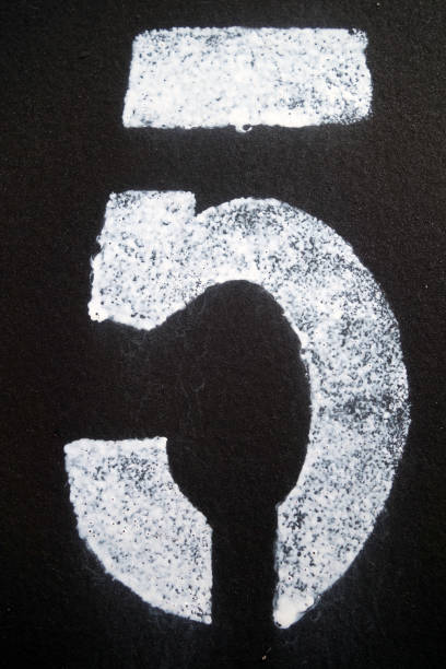istock Number 5 in stencil on metal wall. 1153719398