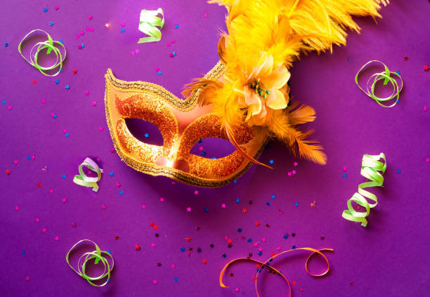 istock Carnival mask on purple background with sparkles. Festive backdrop for projects. 1153719559