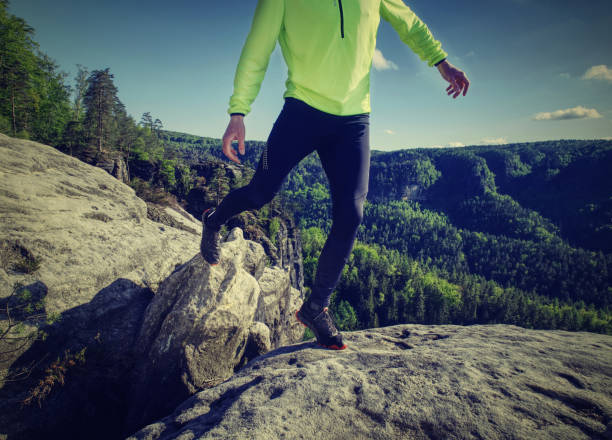 istock Runner in yellow green shinning  jacket and black leggings 1153721316