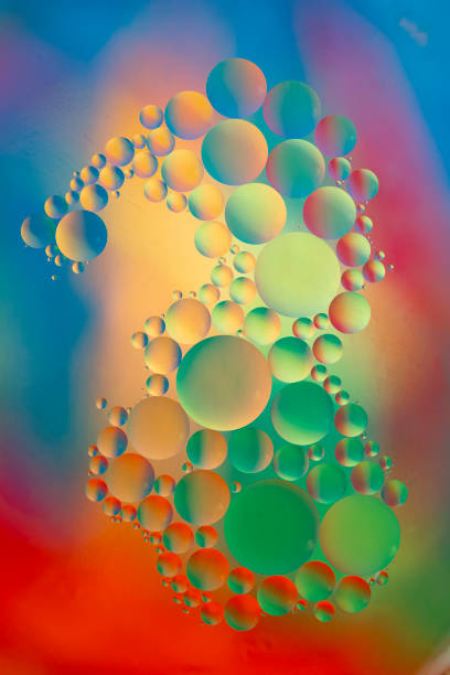 istock Colored Oil Drops on Water 1153722642