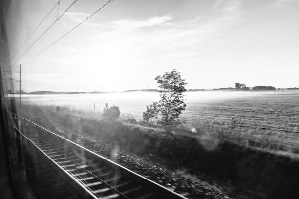 View out of train window on fields of East German landscape at sunrise