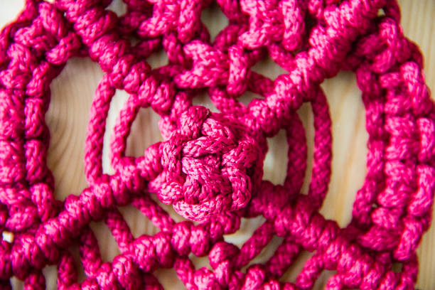 istock Braided rope souvenir on white background 1153724244