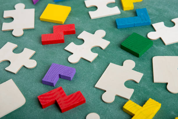 istock Creative solution for idea - business concept, jigsaw puzzle on the blackboard 1153724392