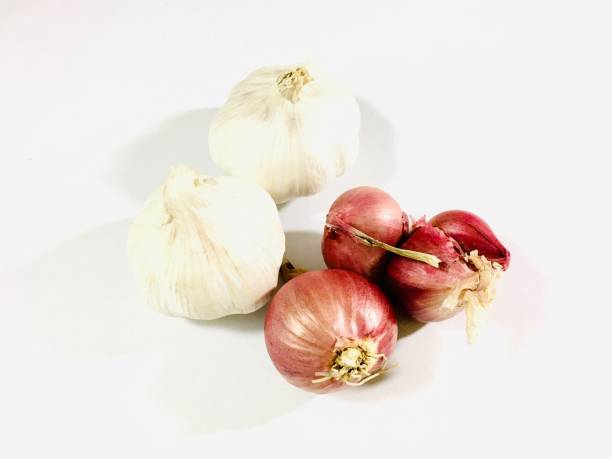 Vegetable and Herb, Heap of Garlics and Shallots, Spanish Onions, or Red Onions Used for Seasoning in Cooking.