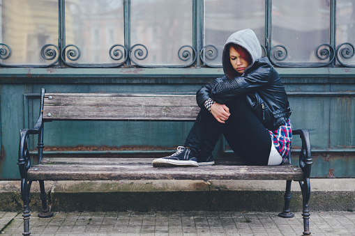 Depressed teenage girl outside
