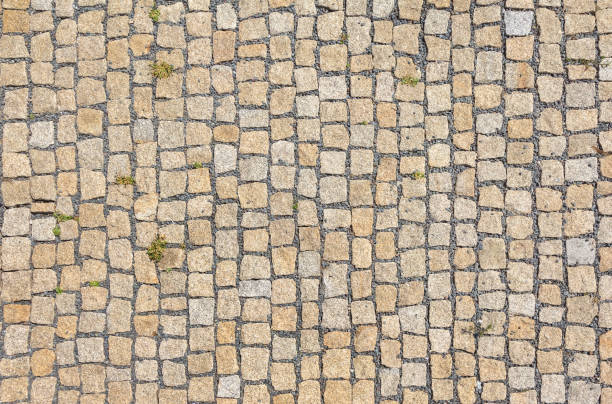 istock Old road paved with granite stones. 1153729652