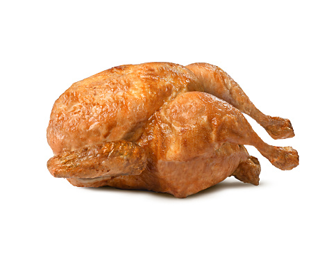 Excellent chicken cooked in a very crisp and succulent rotisserie isolated on a white background