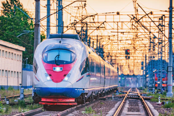 istock Passenger train departs from the station at sunset time. 1153731925