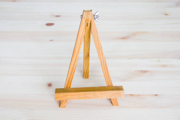 istock Small wooden easel on white background 1153733394