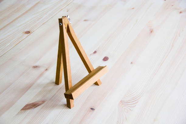 istock Small wooden easel on white background 1153733416