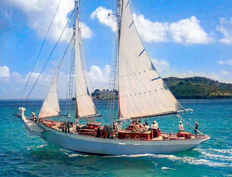 A rare and unique photo of Bob Dylan's yacht Water Pearl leaving St Bart's harbour under full sail.