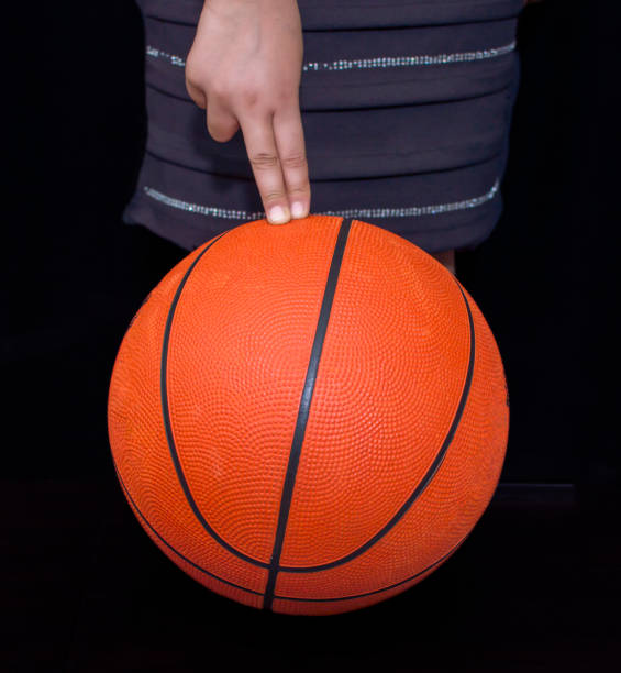 istock Fingers on the basketball 1153736001