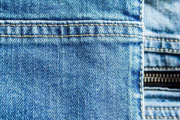 istock Blue jeans denim textile with seam and zipper  texture background. 1153736721