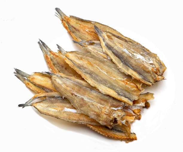 istock salted fishes on white background 1153736944