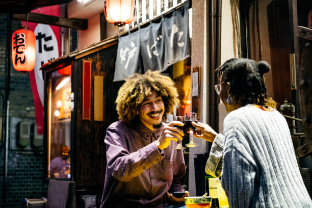 istock Young man and woman toasting with wine on date 1153738784