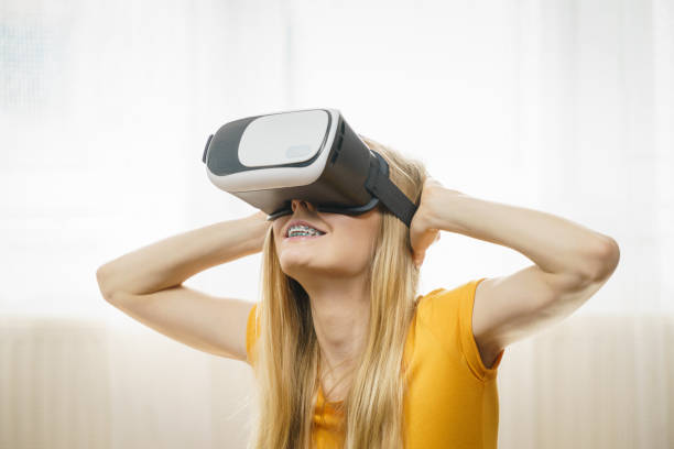 istock Girl wearing virtual reality goggles. 1153739441