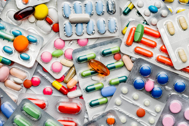 Background of a large group of assorted capsules, pills and blisters stock photo