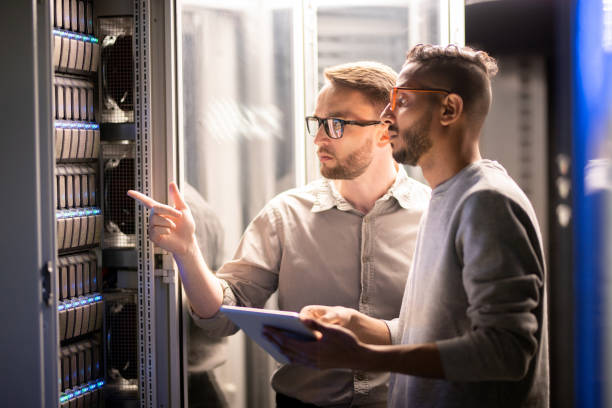 istock Team of specialists managing network server 1153742598