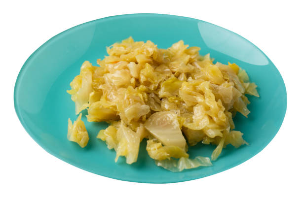 istock braised cabbage in plate isolated on white background.  cabbage top view 1153743461