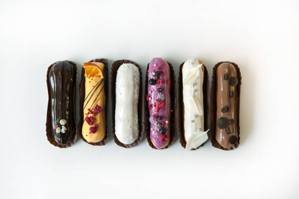 istock Set of several eclairs with various fillings and design isolate on a white background, the concept of French cuisine 1153744007