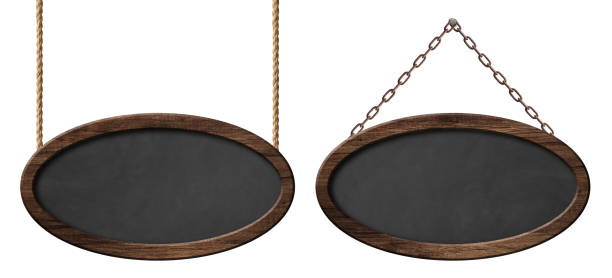 Oval blackboard with dark wooden frame hanging on ropes and chains Empty oval blackboard with dark wooden frame hanging on ropes and chains. Isolated on white background picture frame frame ellipse black stock pictures, royalty-free photos & images