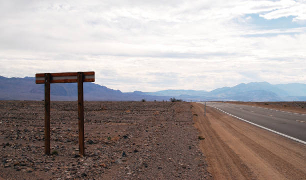 istock Road sign on a highway through the desert 1153750420