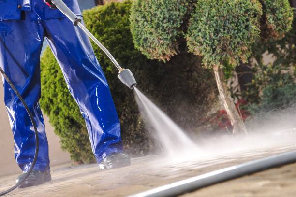 istock Men Washing Garden Paths 1153750425