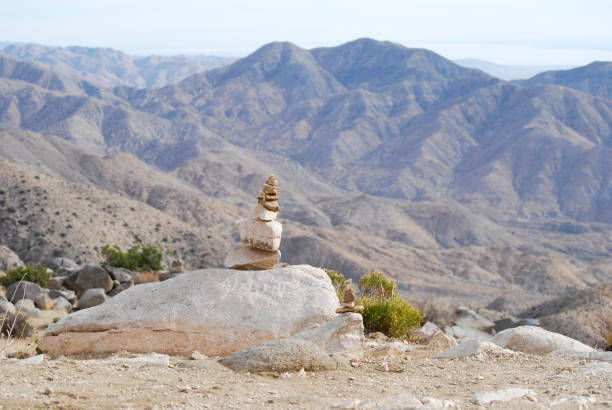 istock Mountain dry landscape with a stone cairn 1153750458