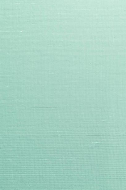 istock Silk cotton linen blended fabrics textile textured background in light cyan blue turquoise aqua green color 1153752379